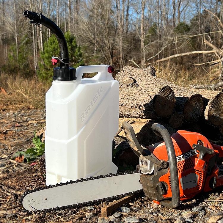 EZ Utility Jug sitting next to a chainsaw in an outdoor scene with trees in the background.