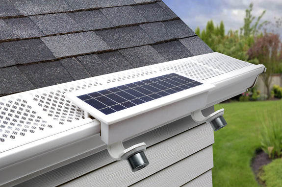 EZ Home Security FLEXIT SpotLight mounted on a white gutter with gutter guard.