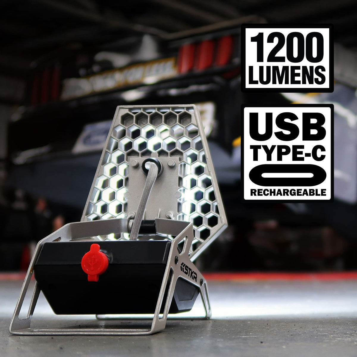 USB Type-C rechargeable light with honeycomb design on a blurred background