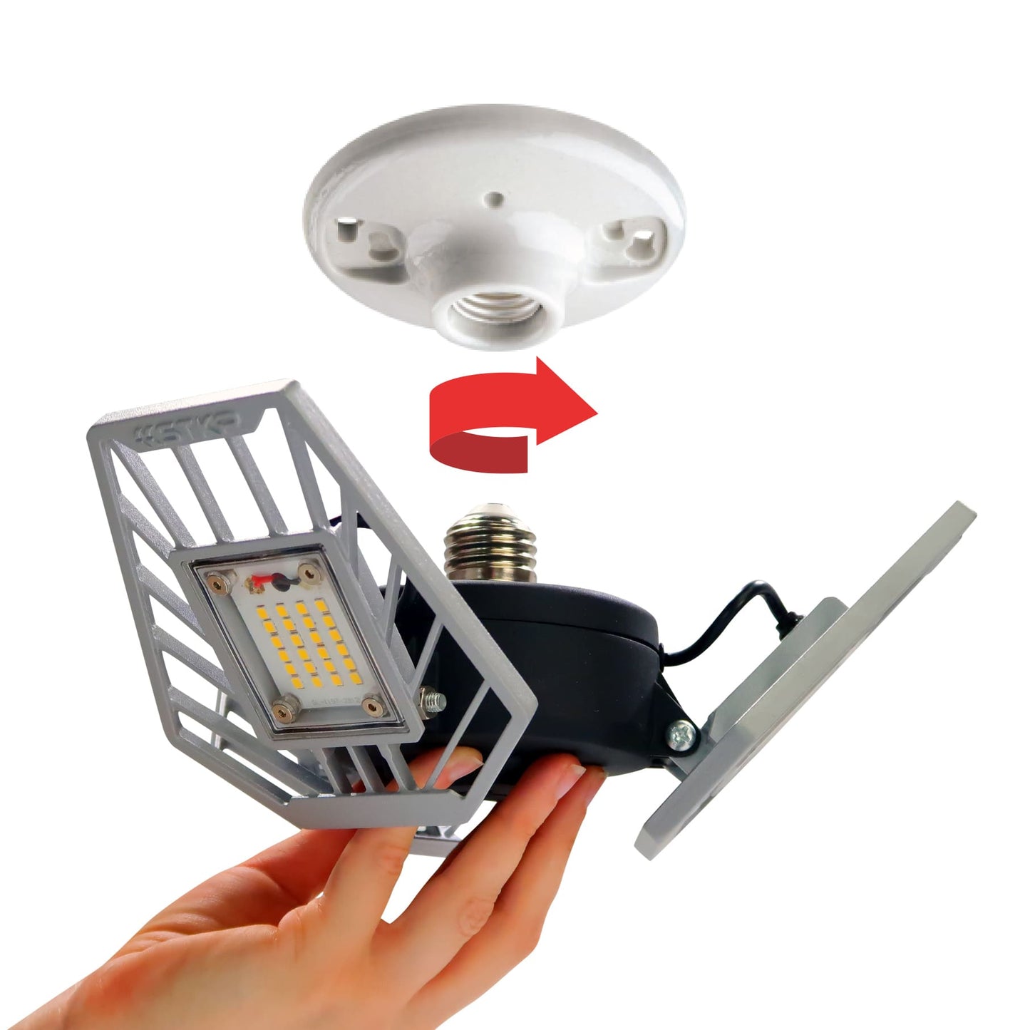 Hand holding TRiLIGHT 2.0 below a ceiling socket to show twist-in installation