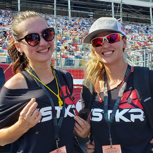 two ladies wearing STKR T-shirts